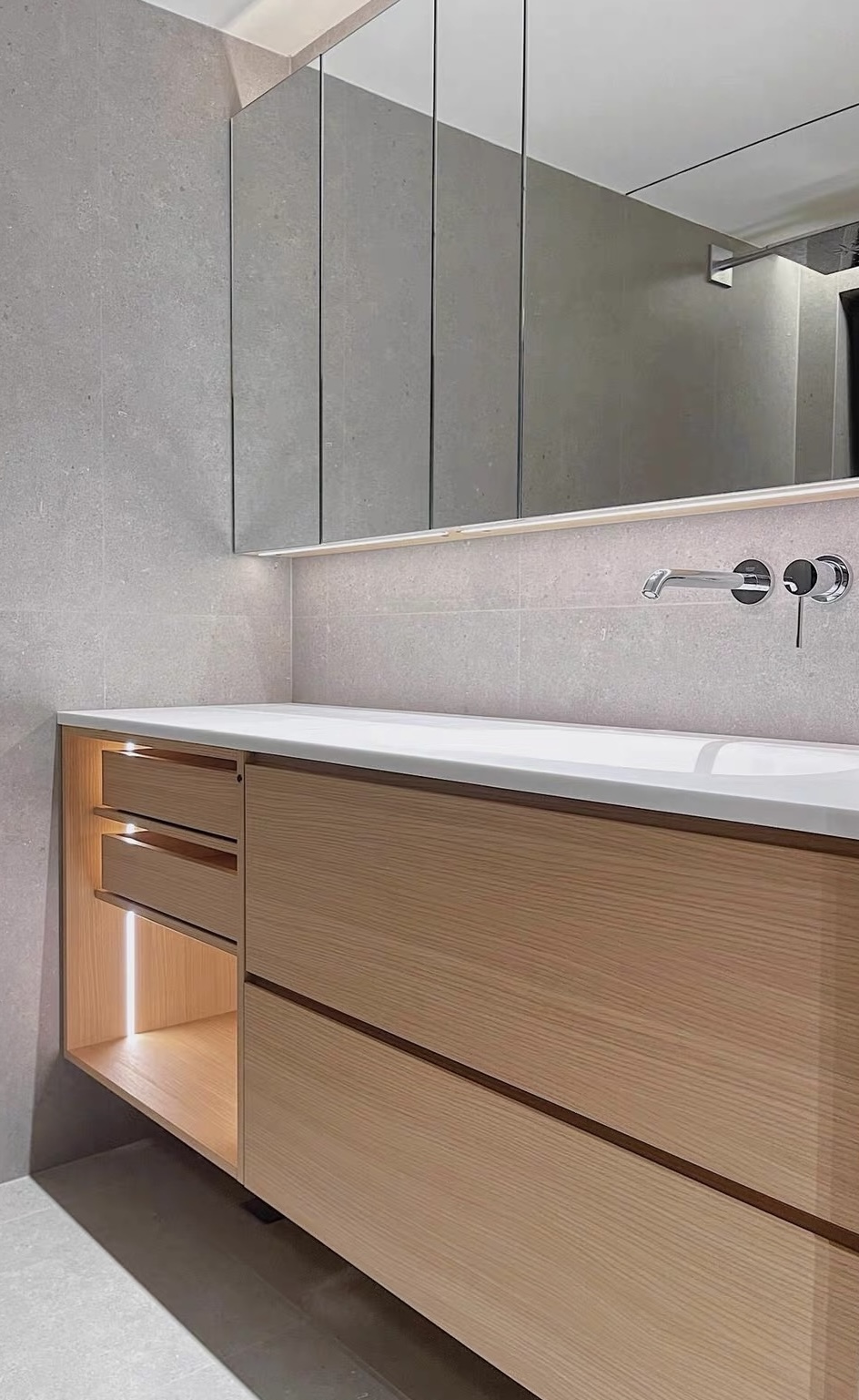 Lave custom oak vanity with integrated sintered stone basin, wall-mounted matte black tap and herringbone floor — Minimal Japandi collection