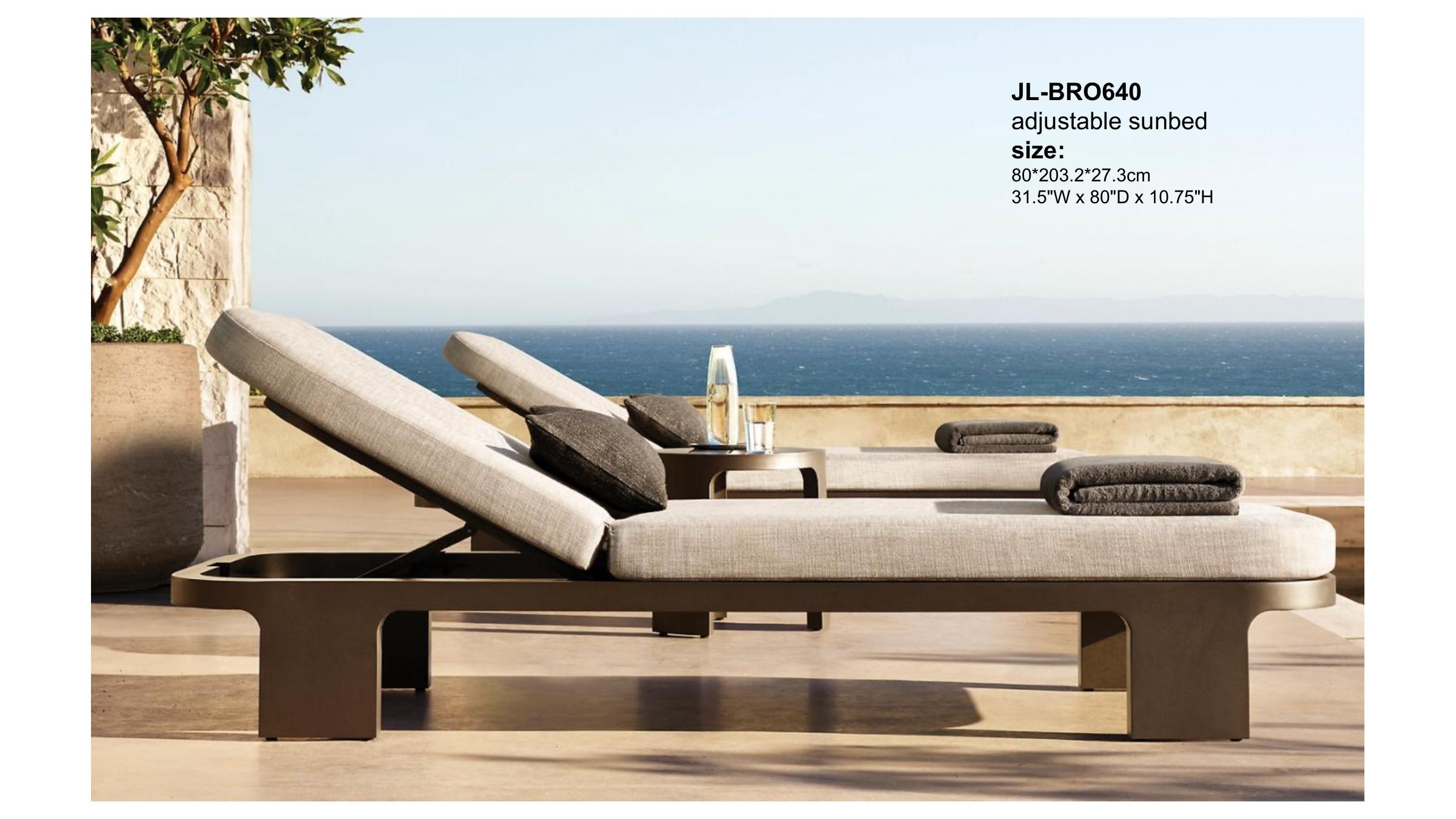 VIG collection low-profile teak daybeds beside a fire pit at sunset