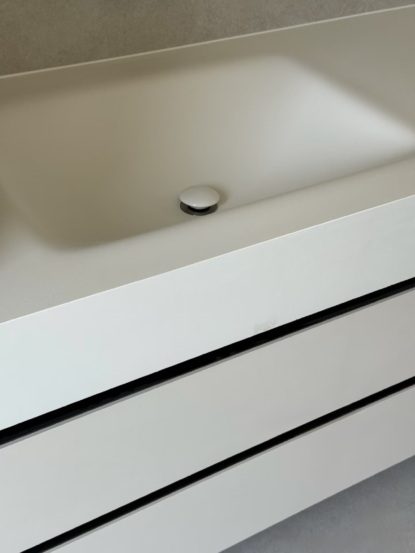 Lave 47.24 in custom bathroom vanity in custom light grey cabinet finish with 5.91 in fascia sintered stone basin, installed in Bath