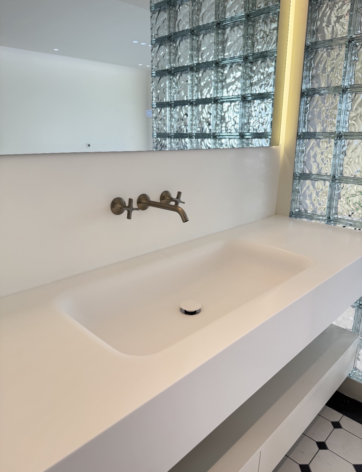 Lave integrated sink and countertop in a completed London bathroom