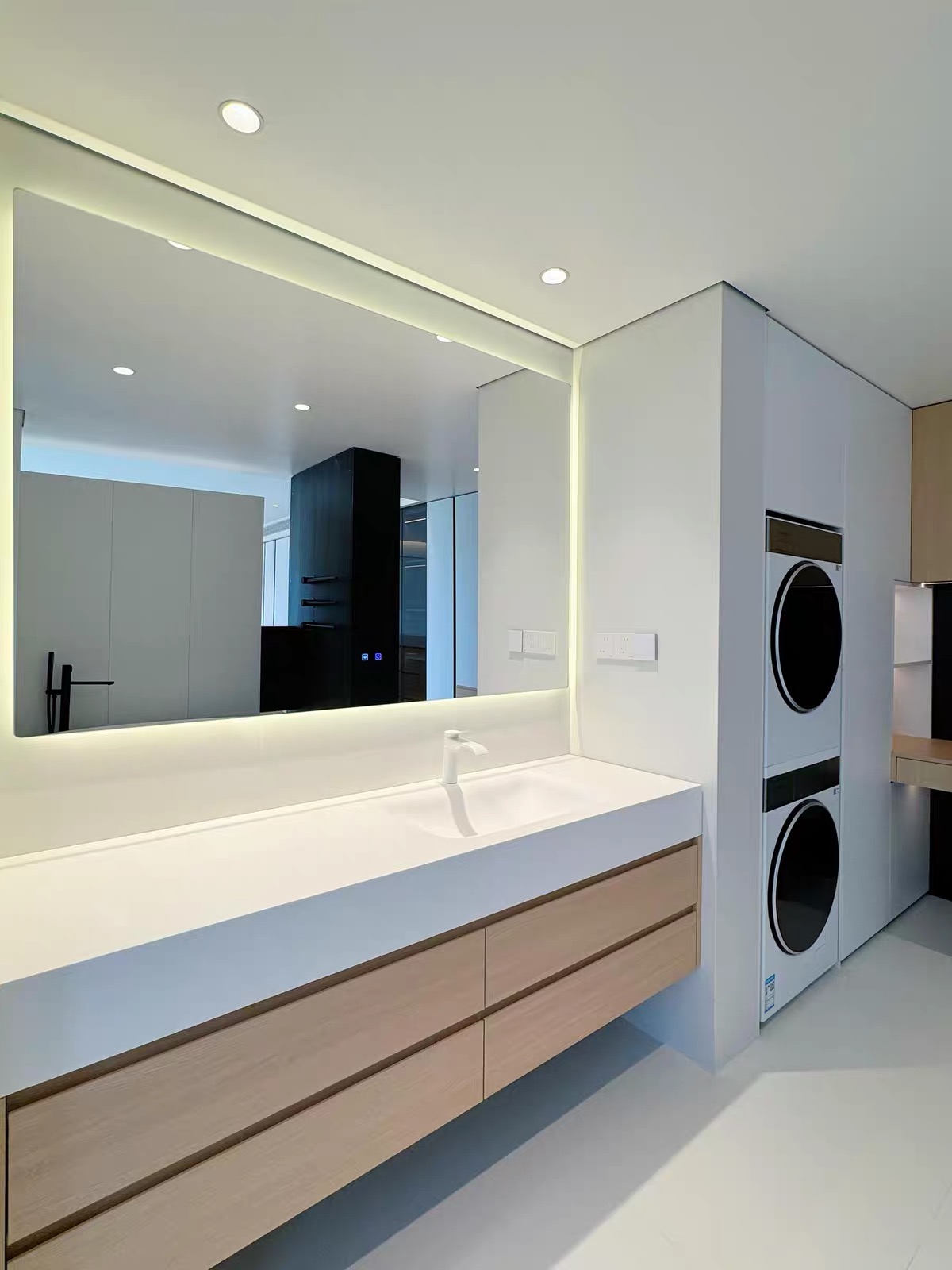 Emily S — installed Lave floating oak vanity with integrated basin and backlit mirror